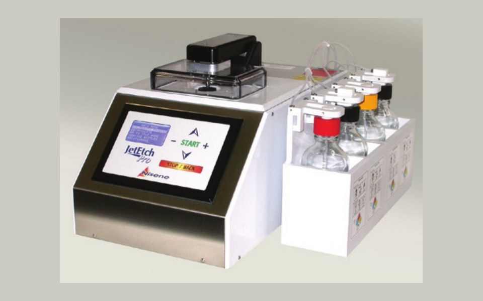 JetEtch Pro automated acid decapsulation system, showing the touchscreen control panel, sealed process chamber and four-bottle reservoir module.